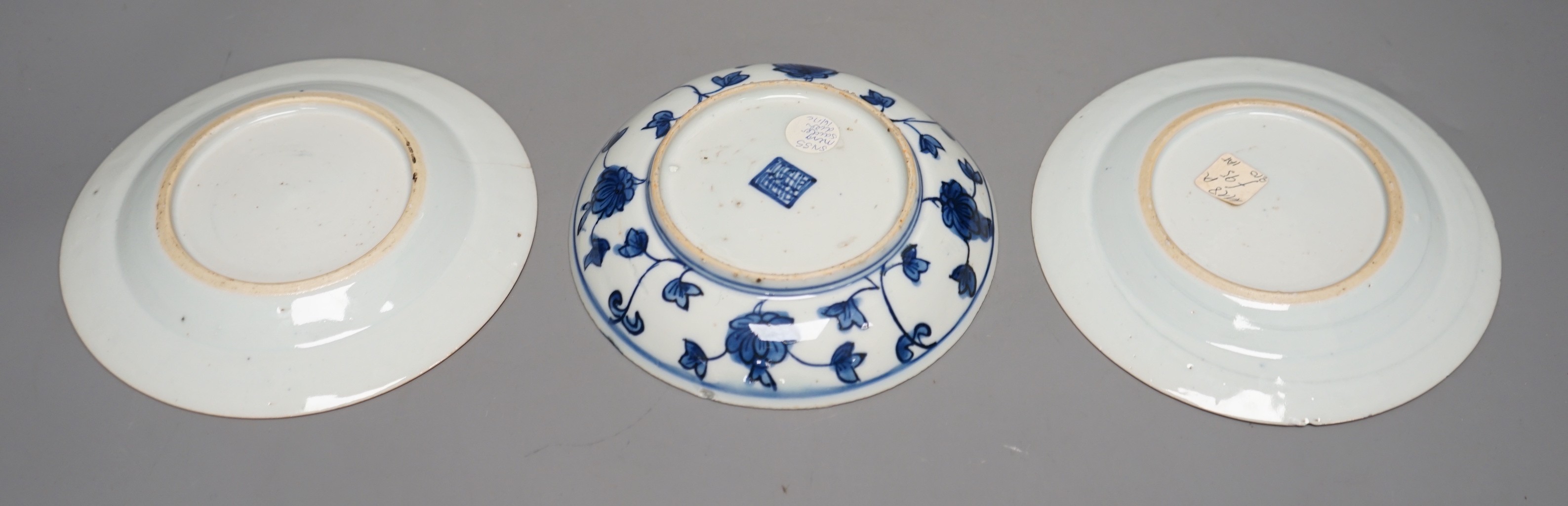 A pair of 18th-century Chinese blue and white plates and another blue and white saucer dish, largest 16cm